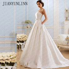 Load image into Gallery viewer, Modern strapless satin box pleated ball gown with pockets.
