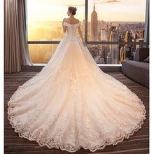 Load image into Gallery viewer, Stunning off the shoulder boat neck lace applique ball gown.