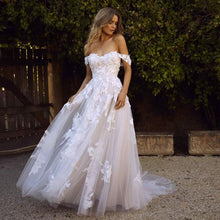 Load image into Gallery viewer, Off the shoulder lace appliqued tulle wedding gown.