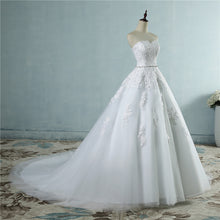 Load image into Gallery viewer, Strapless floral lace appliqued ball gown with embellished waist sweetheart neckline, laced corset back and court length train.