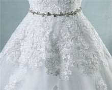 Load image into Gallery viewer, Strapless floral lace appliqued ball gown with embellished waist sweetheart neckline, laced corset back and court length train.