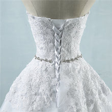 Load image into Gallery viewer, Strapless floral lace appliqued ball gown with embellished waist sweetheart neckline, laced corset back and court length train.