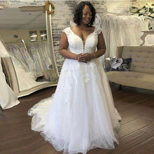 Load image into Gallery viewer, Stunning tulle wedding gown with lace appliques, capped sleeves and chapel length train