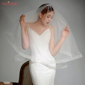 Hand made double teir, 2 layer fingertip length wedding veil with comb, blusher layer, and, horsehair hem.