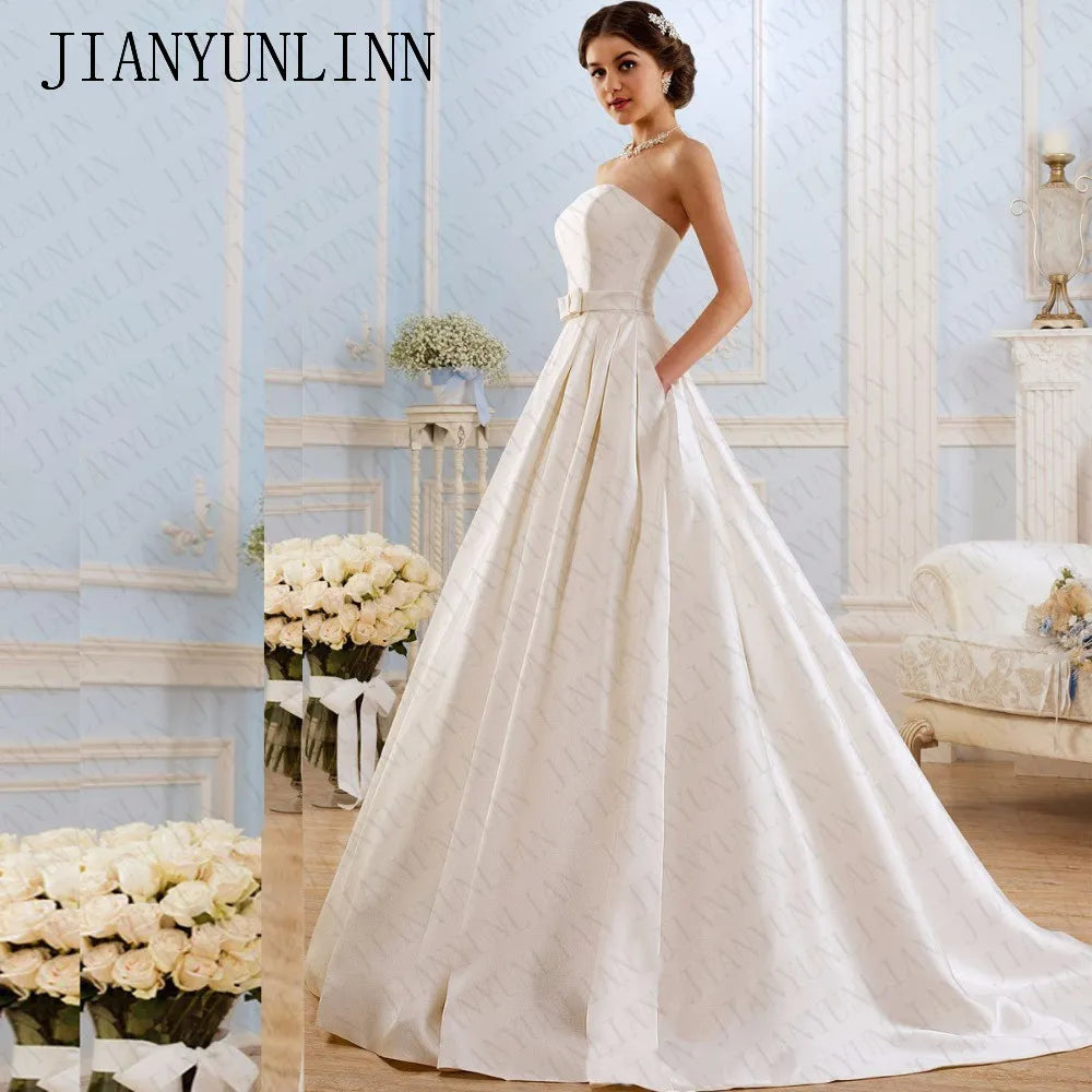 open lace back dress Modern Strapless Satin Box Pleated Ball Gown with Pockets. White / 16