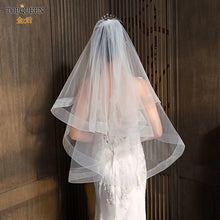 Load image into Gallery viewer, Hand made double teir, 2 layer fingertip length wedding veil with comb, blusher layer, and, horsehair hem.
