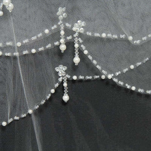 Scalloped beaded edge wedding veil with blusher.