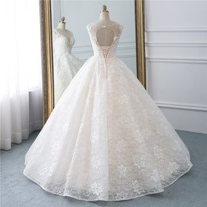 Spectacular natural waist A-line ball gown with a modest illusion sweetheart neckline