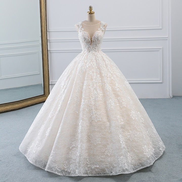 Spectacular natural waist A-line ball gown with a modest illusion sweetheart neckline