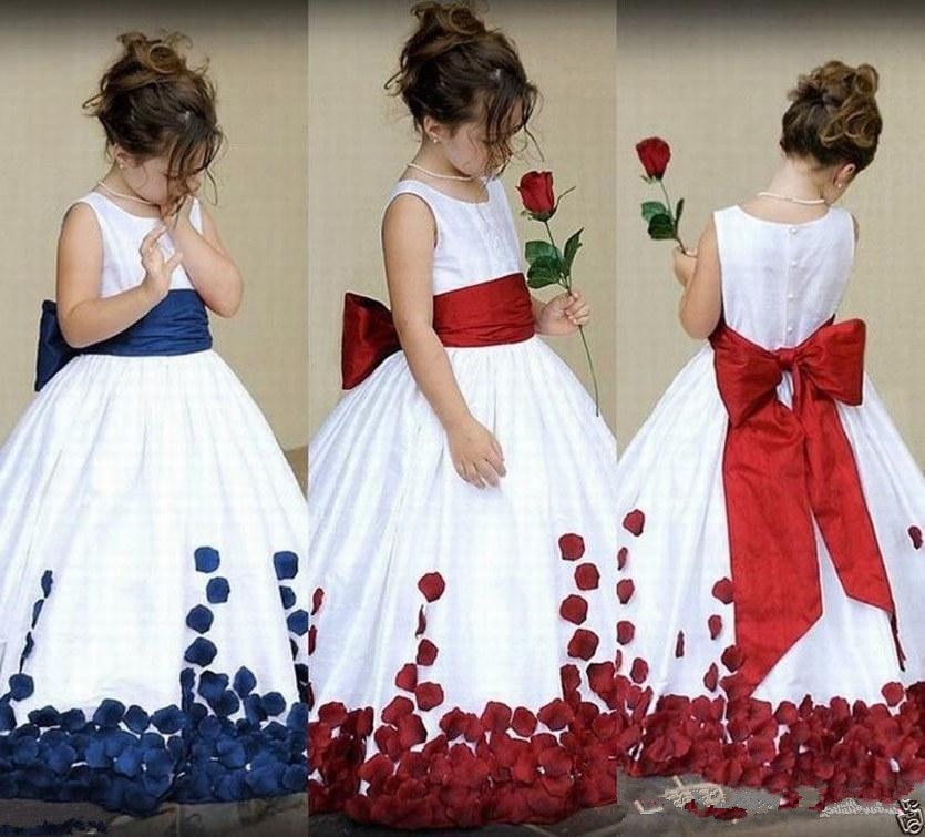 Flower girl dress with waist sash, back bow and coordinating rose petal accents. Available in a variety of colors. Call Oh My LLC @ 269-262-4813for more details